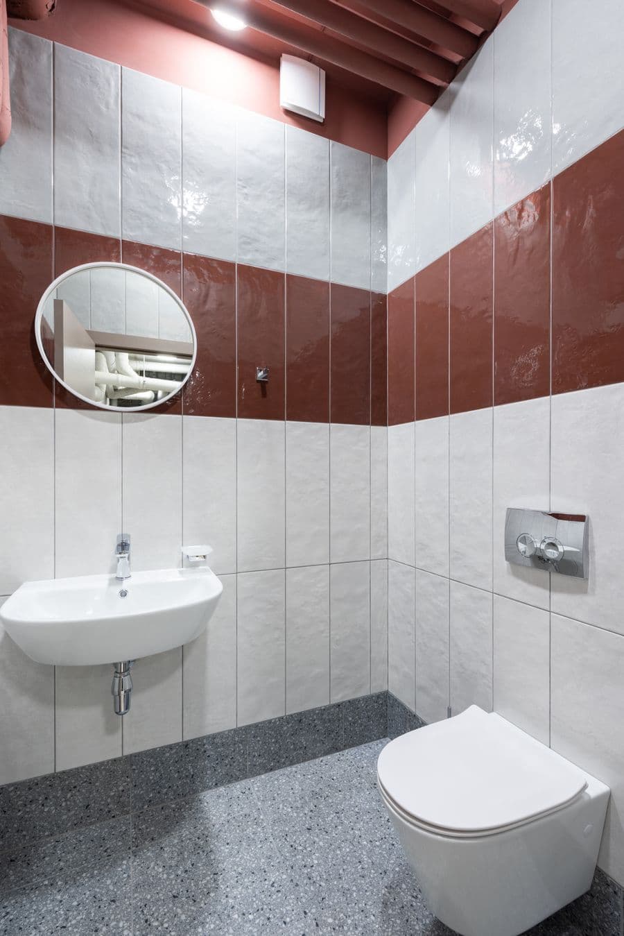 Close-up of bathroom wall tiles showing early damp damage