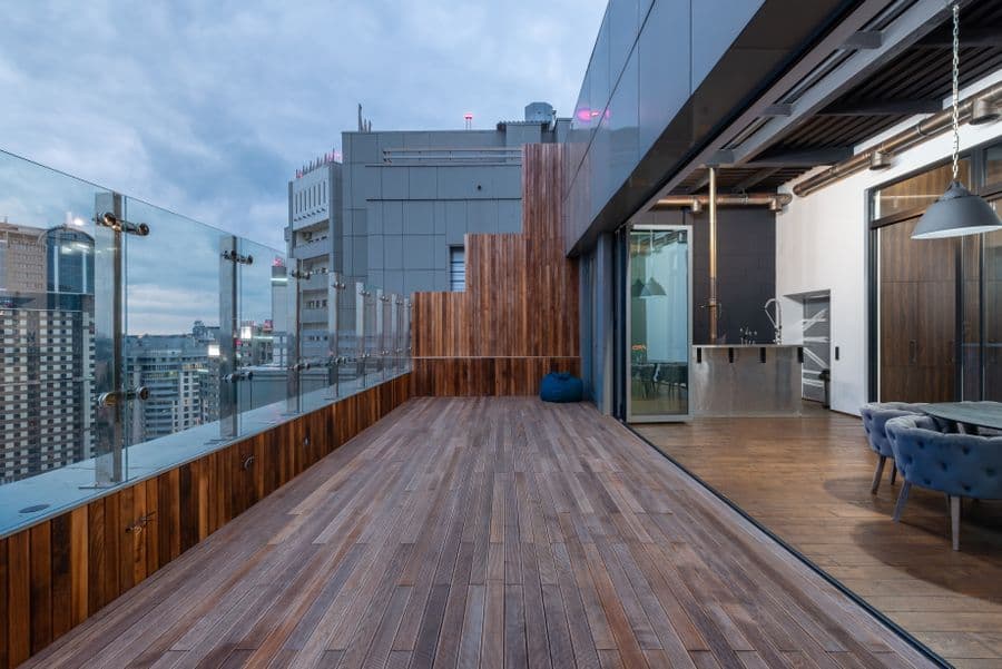 Spacious rooftop terrace checked for grouting gaps and water slope